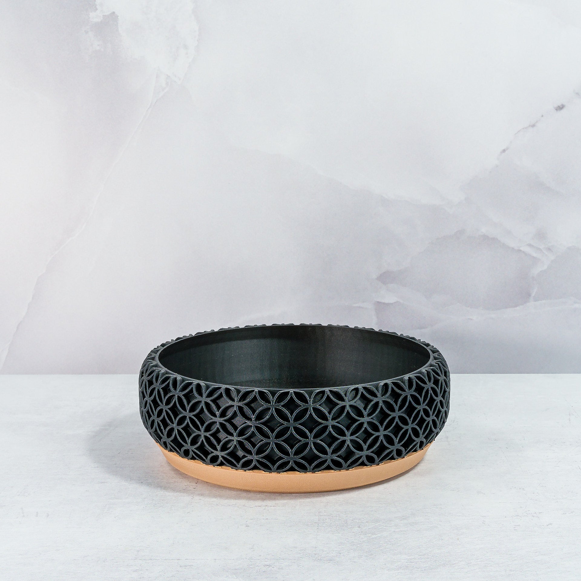 "Empty BLOSSOM bowl planter front view, showcasing wood base with intricate carbon fibre pattern."
