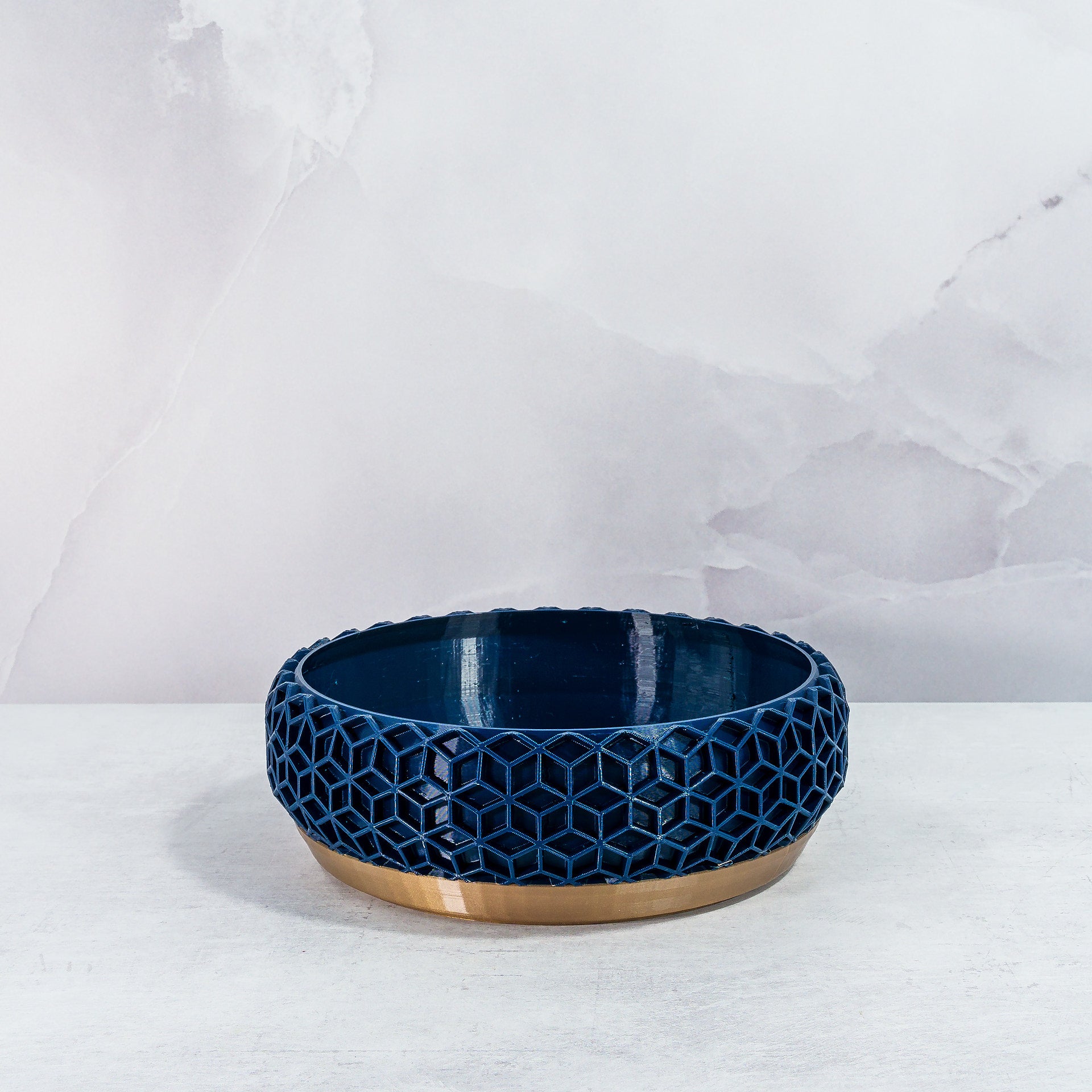 "Front-facing empty HONEYCOMB bowl planter with gold base and detailed navy pattern."
