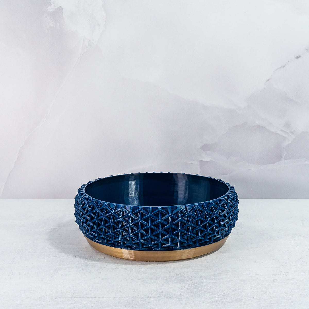 "Front view of empty STELLAR bowl planter with gold base and deep navy pattern."
