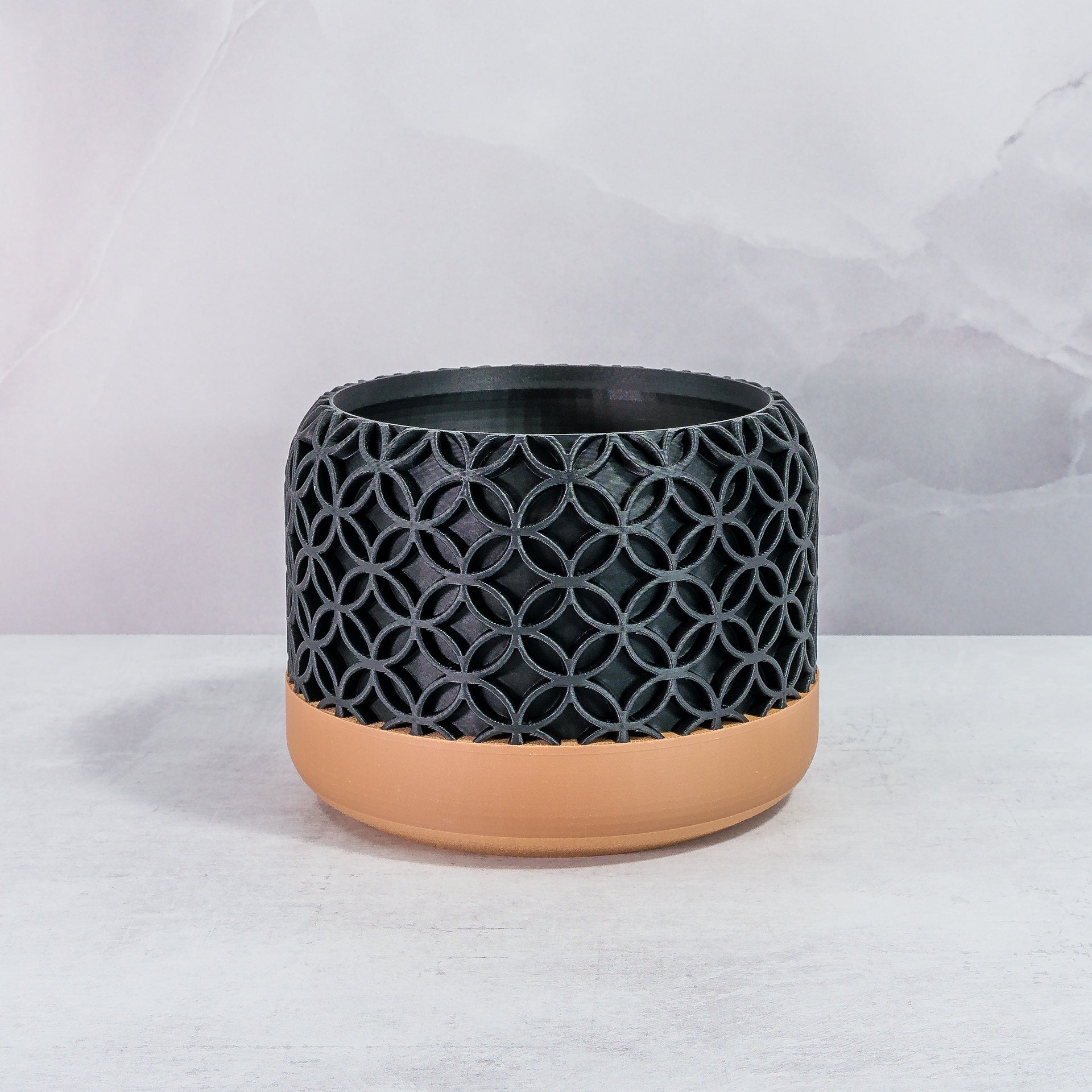 Front Facing: "BLOSSOM planter with wood base and carbon fibre pattern, front view."
