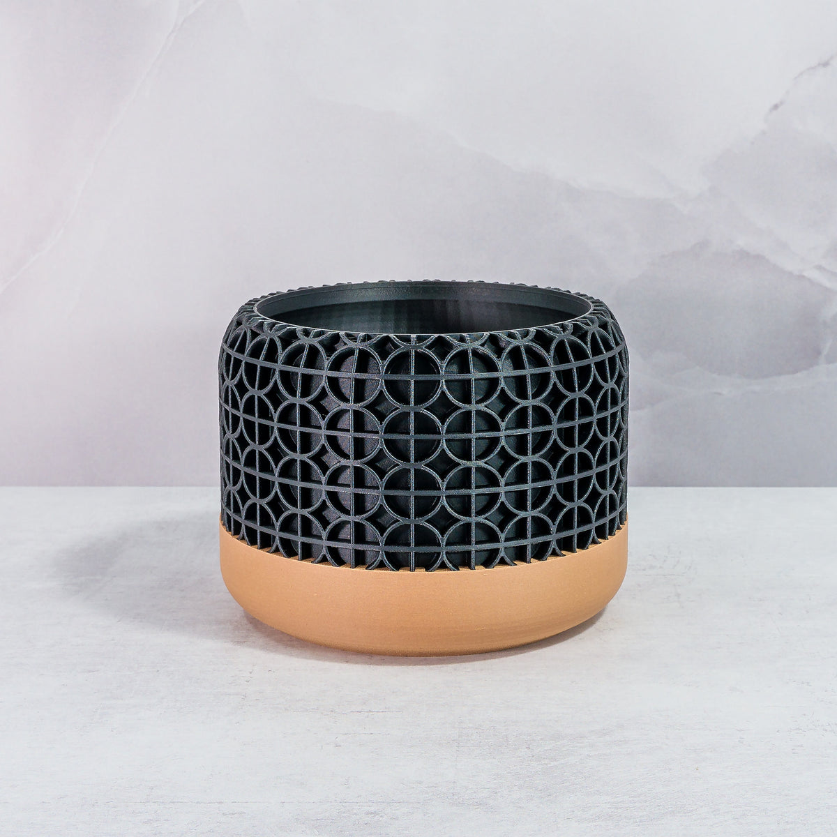 Front Facing: "CROSSORB planter with wood base and carbon fibre pattern, front view."
