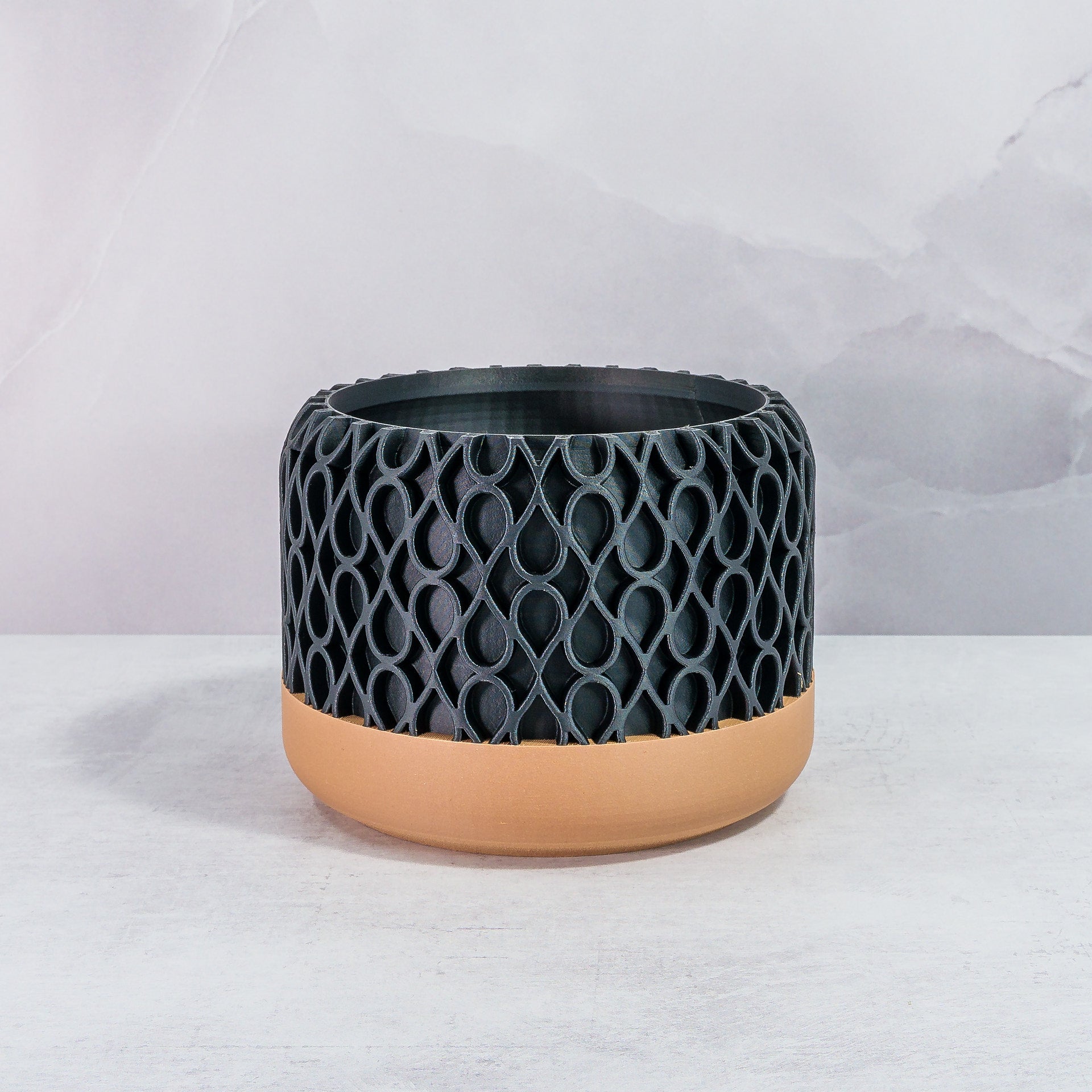 Front Facing: "DROPLET planter with wood base and carbon fibre pattern, front view."
