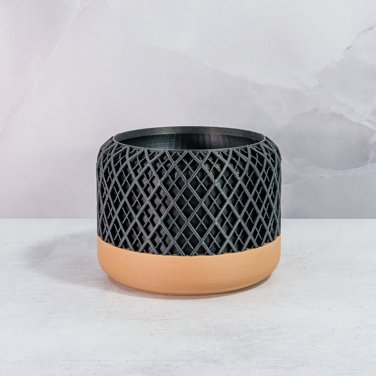 Front Facing: "HATCH planter with wood base and carbon fibre pattern, front view."
