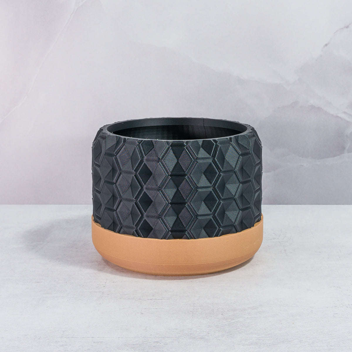 Front Facing: "HEXA planter with wood base and carbon fibre pattern, front view."
