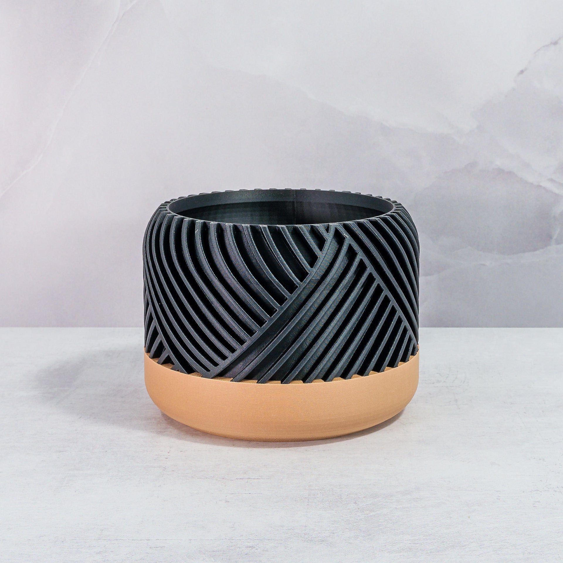 Front Facing: "PEAK planter with wood base and carbon fibre pattern, front view."
