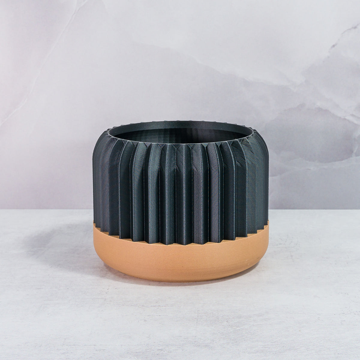 Front Facing: "TRILINEAR planter with wood base and carbon fibre pattern, front view."
