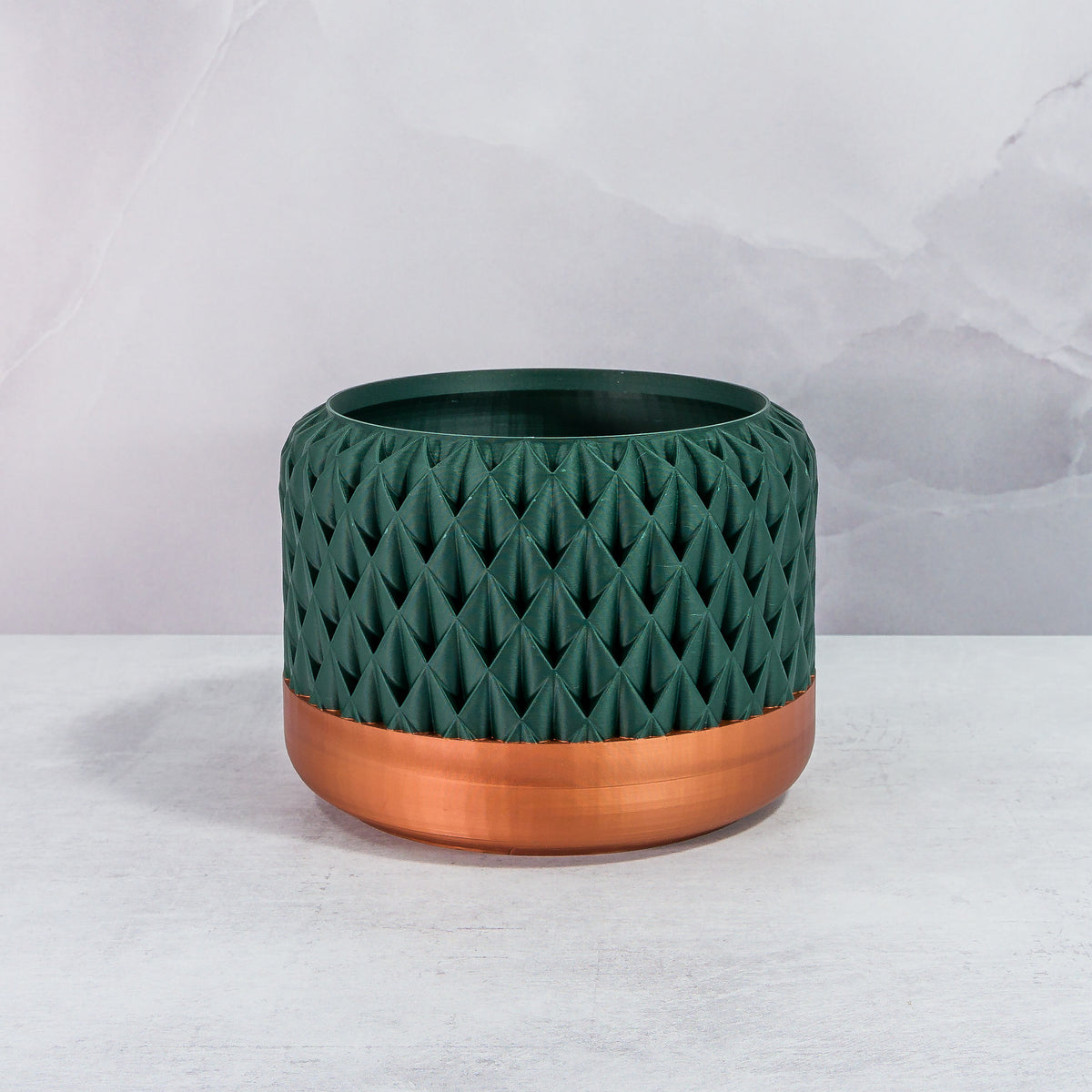 Front Facing: "ANANAS planter with copper base and deep green forest pattern, front view."
