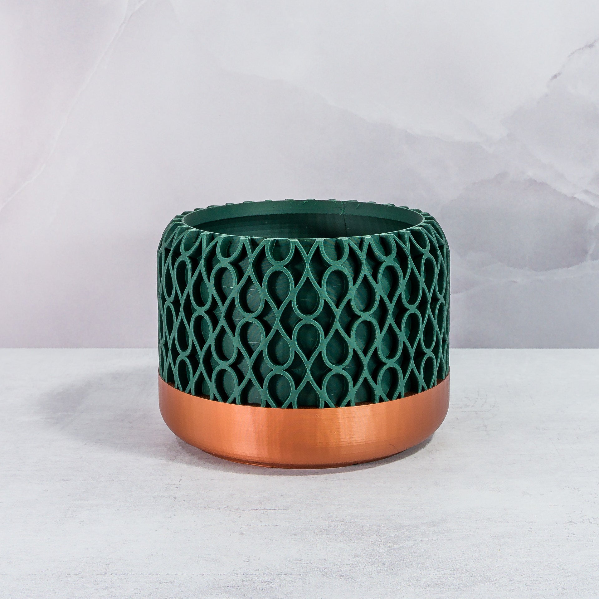 Front Facing: "DROPLET planter with copper base and deep green forest pattern, front view."
