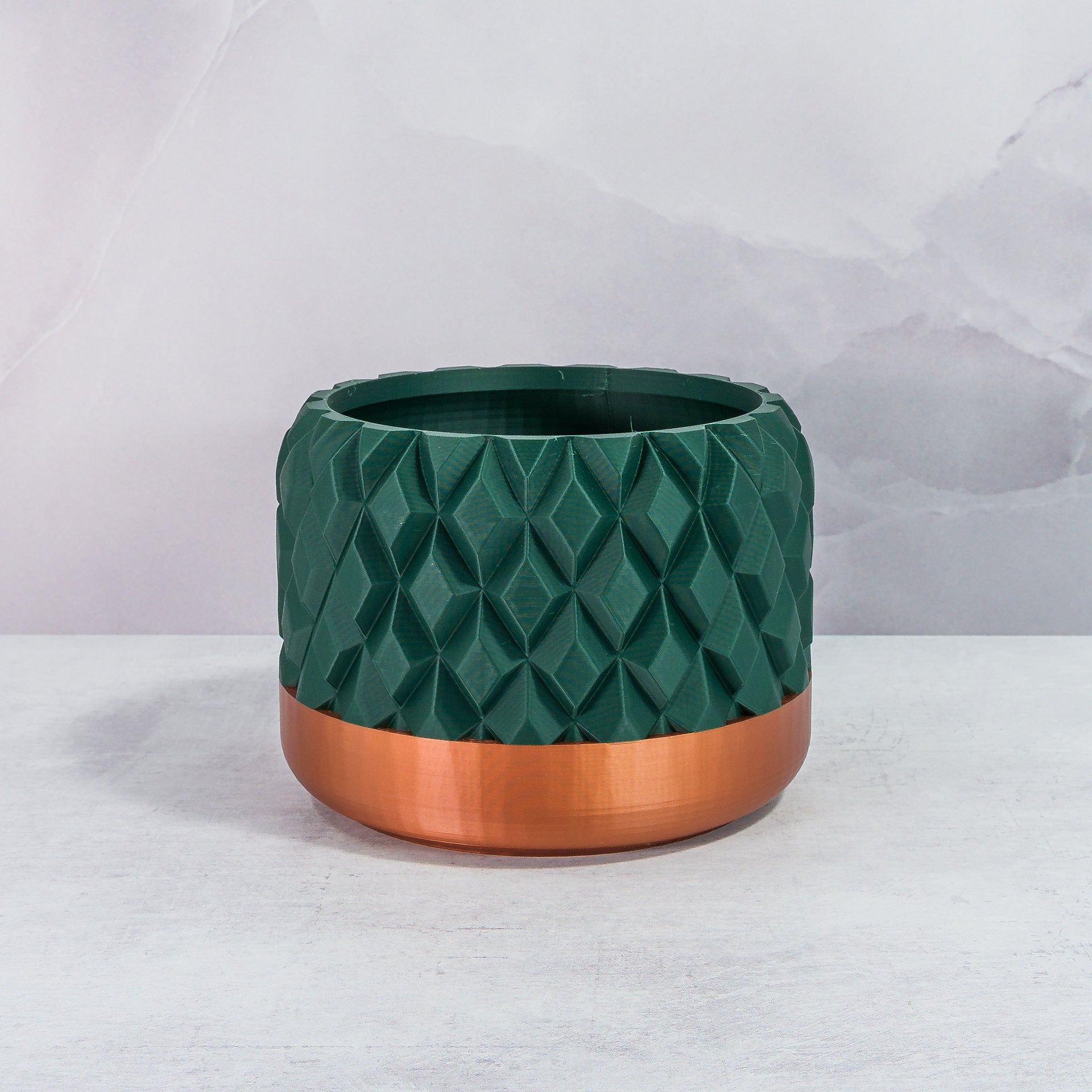 Front Facing: "GEM planter with copper base and deep green forest pattern, front view."
