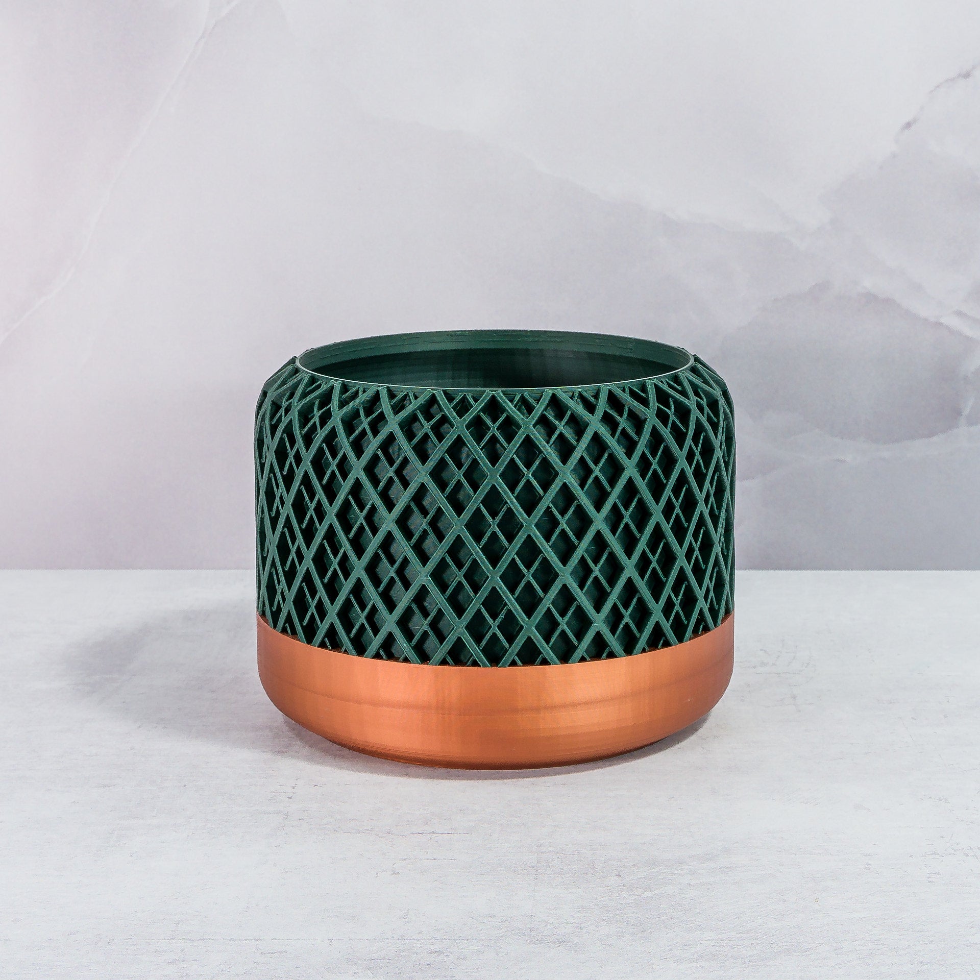 Front Facing: "HATCH planter with copper base and deep green forest pattern, front view."
