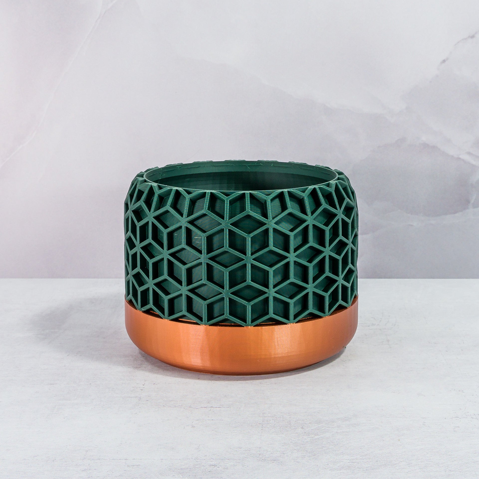 Front Facing: "HONEYCOMB planter with copper base and deep green forest pattern, front view."
