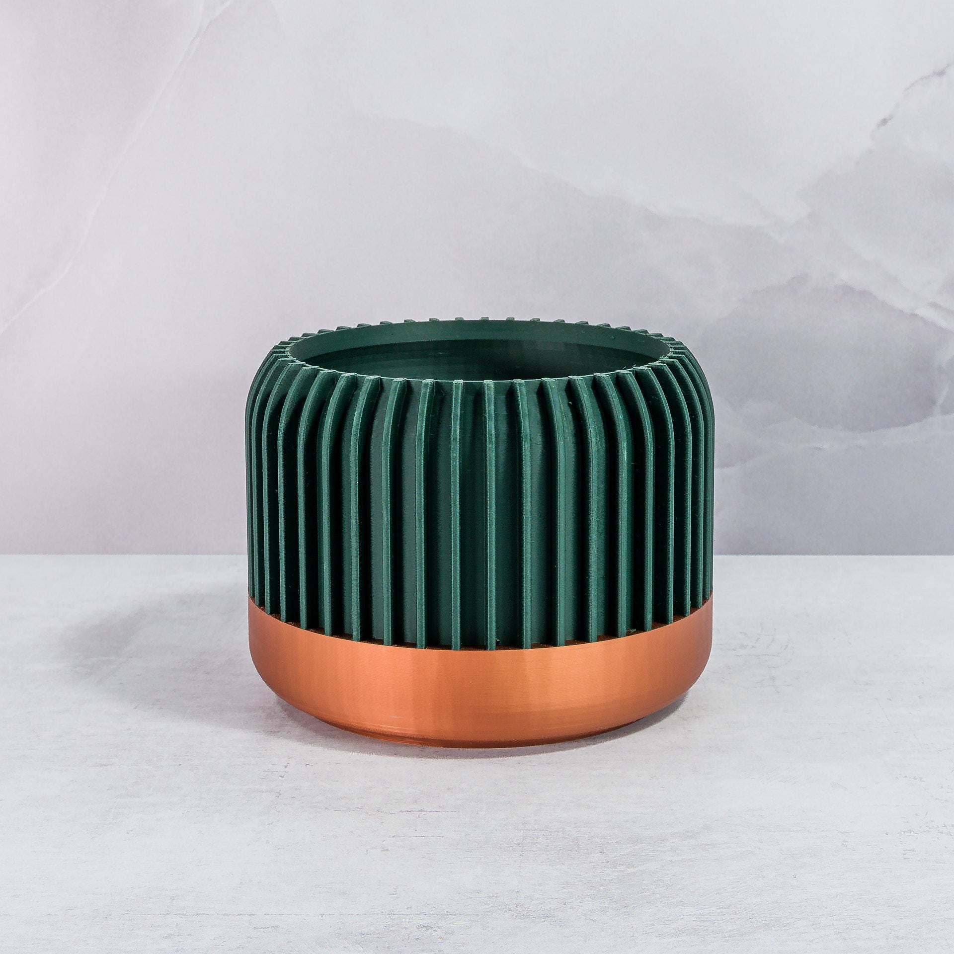 Front Facing: "LINEAR planter with copper base and deep green forest pattern, front view."
