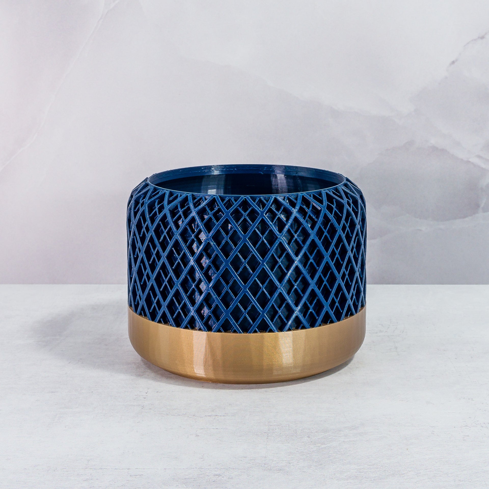 Front Facing: "HATCH planter with gold base and navy pattern, front view."
